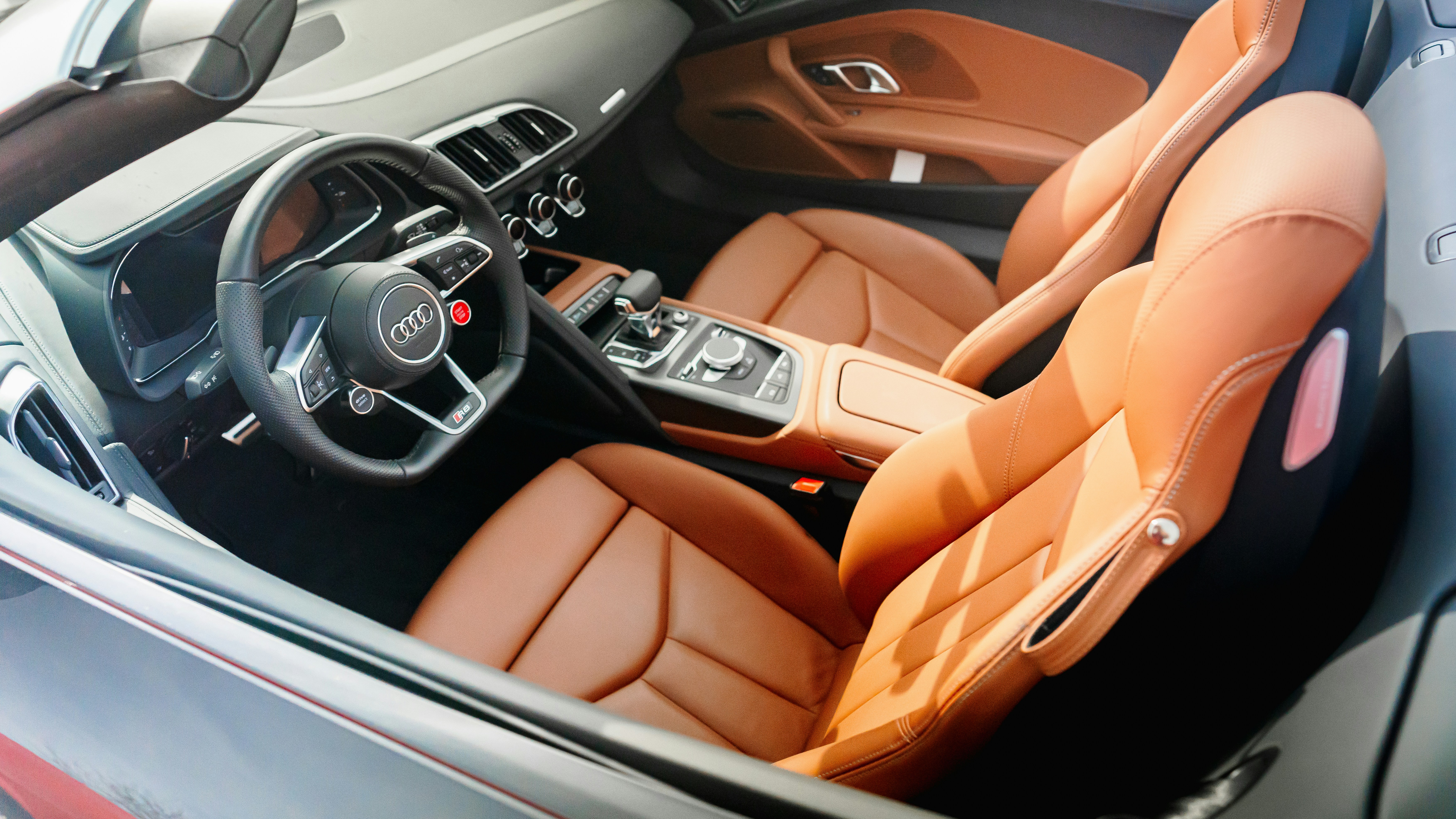 Luxury vehicle leather interior and dashboard detail showcasing precision craftsmanship